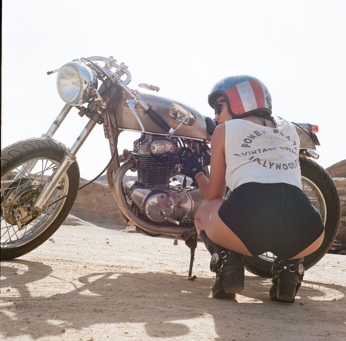 A playful frame from Girls on a motorcycle — online in Riyadh